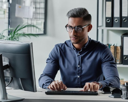 A man staring at a laptop