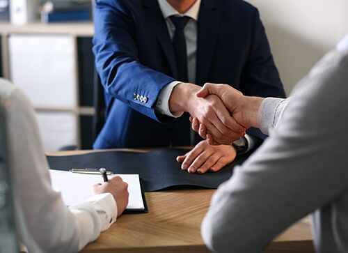 two men shaking hands in agreement