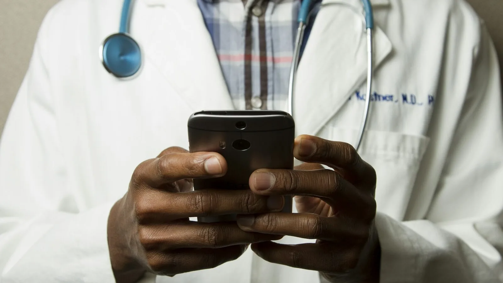 Healthcare professional using a secure behavioral health mobile application on a smartphone