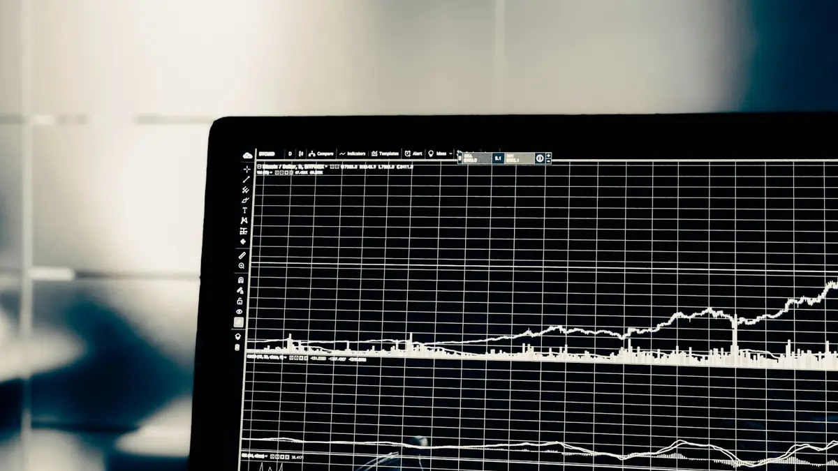 A computer monitor displaying a fine-grained time-series line chart on a dark background.