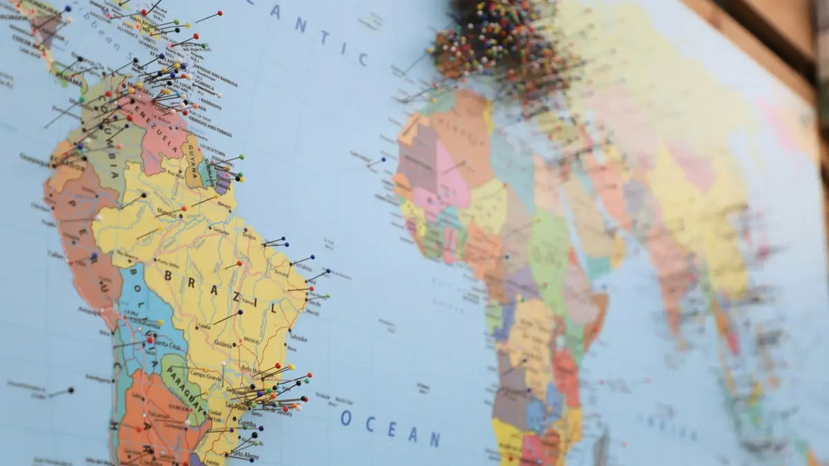 A political world map showing named countries, marked with pins across several continents.