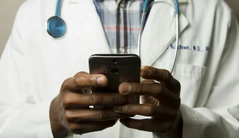 Healthcare professional using a secure behavioral health mobile application on a smartphone