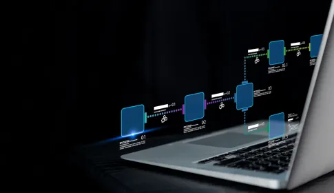 Holographic IT workflow diagram with numbered process nodes above a laptop, representing enterprise automation.