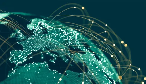Glowing digital globe showing Europe and Africa with golden arc connections representing global enterprise IT network infr...