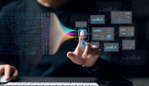 Professional interacting with AI chip interface generating multiple data analytics dashboards in a dark digital environment.