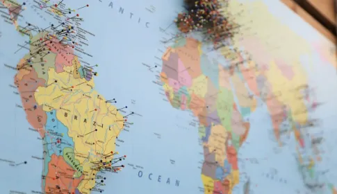 A political world map showing named countries, marked with pins across several continents.
