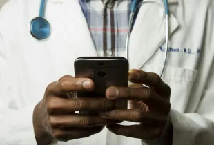 Healthcare professional using a secure behavioral health mobile application on a smartphone