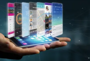 Hand holding a smartphone projecting enterprise mobile app interfaces including banking, messaging, maps and travel.