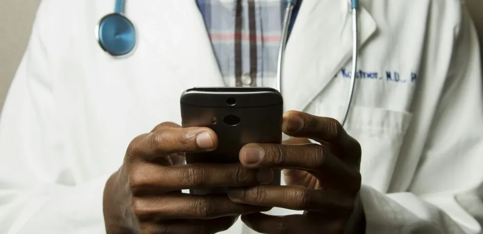 Healthcare professional using a secure behavioral health mobile application on a smartphone