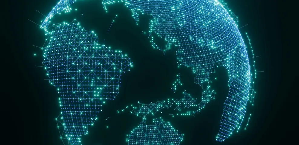 Glowing digital globe with interconnected network nodes representing global IT infrastructure and data connectivity.