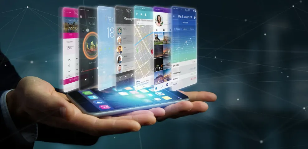 Hand holding a smartphone projecting enterprise mobile app interfaces including banking, messaging, maps and travel.