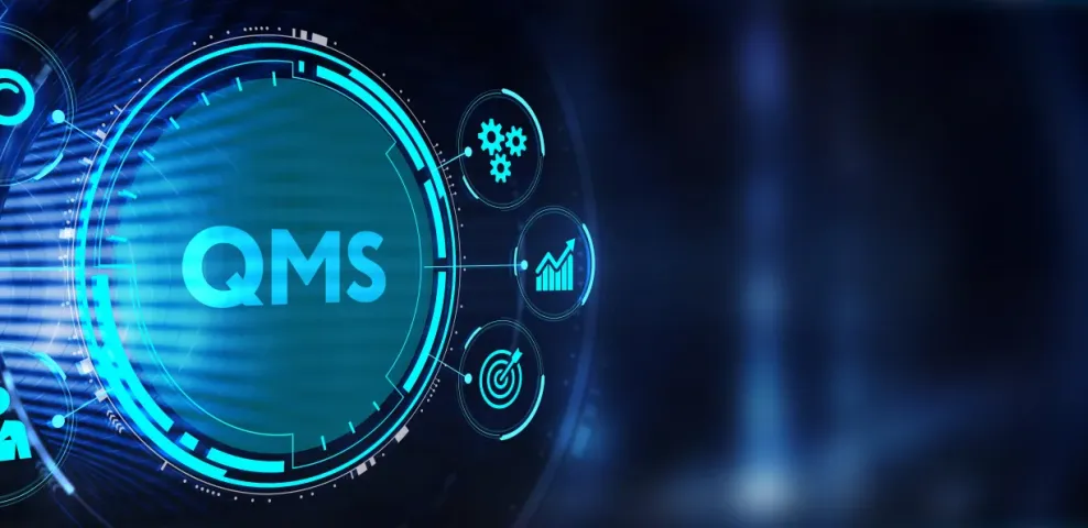 Glowing digital QMS interface ringed by icons for search, analytics, goals, gears and personnel on a dark blue background.